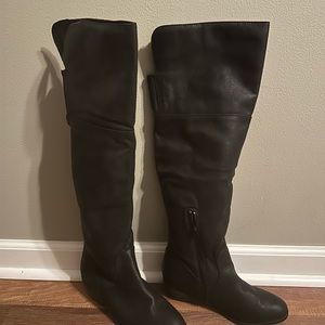 Over the knee black boots.